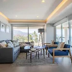 Upscale Corner Unit With Large Wrap Around Balcony And Pools