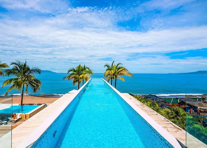 Stunning Beachfront Condo - Sea Views & Pools