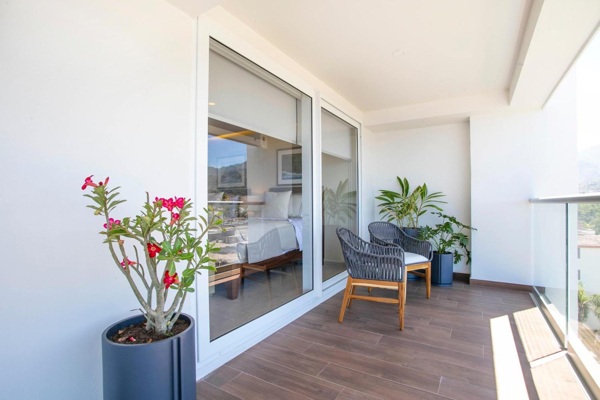 Upscale Corner Unit With Large Wrap Around Balcony And Pools Puerto Vallarta