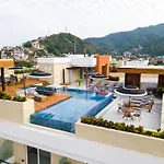 Top Floor Condo With Partial Ocean Views, Pools, Gym