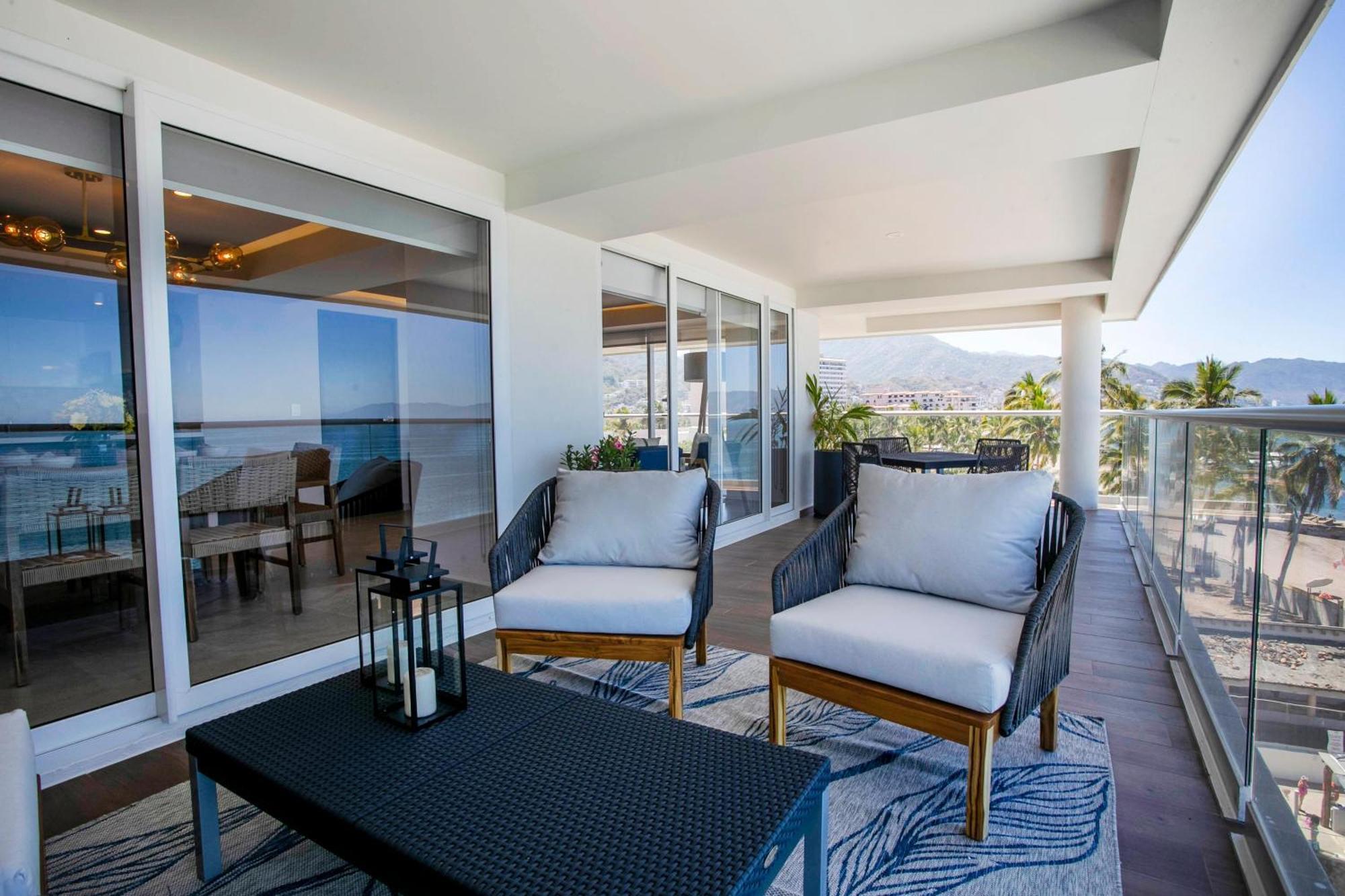 Upscale Corner Unit With Large Wrap Around Balcony And Pools